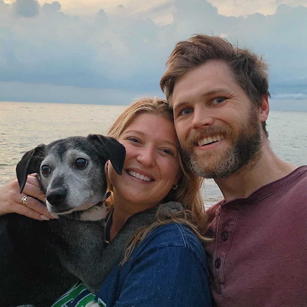 A family photo of Danny, Cristin, and Hershey the Dog